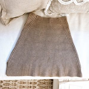 Beige knit mini skirt with little slit on side